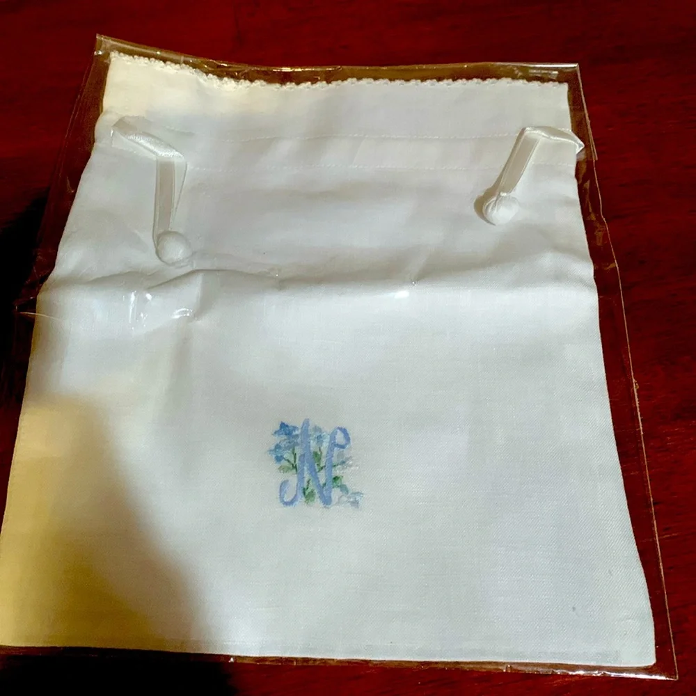 And beautiful hand made rare linen pouch with letter N hand dawn. Brand new!